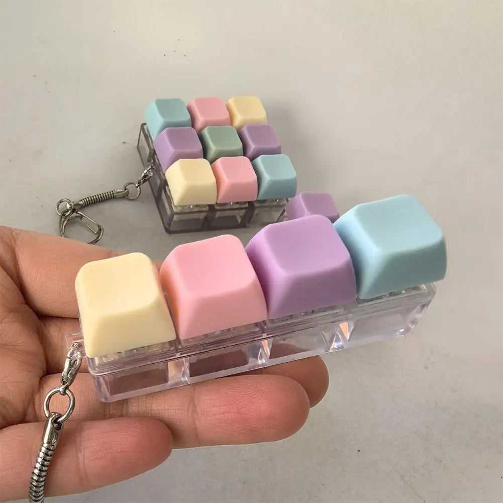 Clik — fidget táctil de teclas mecánicas con llavero.